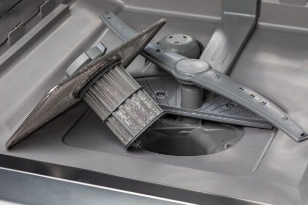 A clogged dishwasher filter from a home in Indianapolis, highlighting a common issue that Unique Repair Services resolves with certified appliance repair and same-day service.