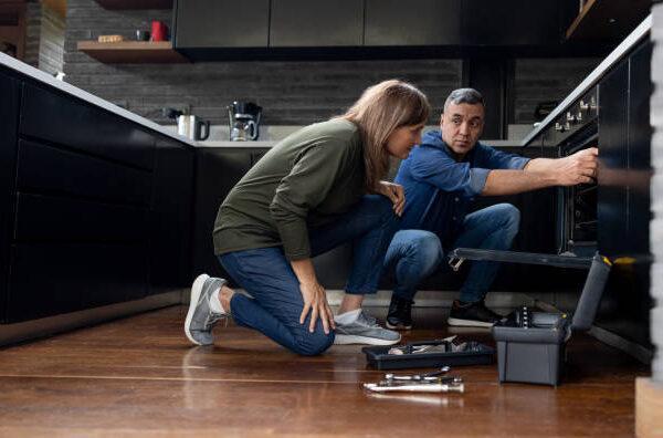 Technician providing same-day appliance repair service in Evanston, IL kitchen