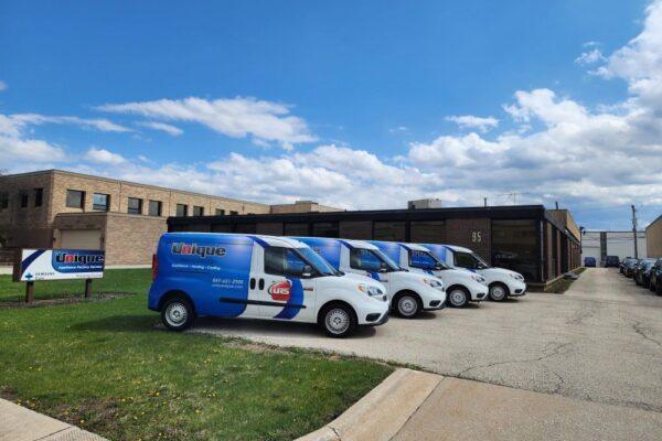 Unique Repair Services appliance repair team in Des Plaines IL with service vans ready to handle home appliance repairs across the Midwest.