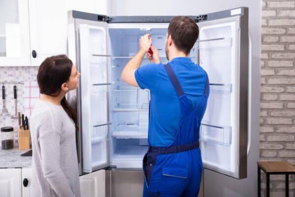 Unique Repair Services provides kitchen appliance repair service in Des Plaines, IL. This image shows a refrigerator being repaired in a local home, reflecting reliable service for homeowners across the Midwest. Certified technicians handle repairs for refrigerators, ovens, and dishwashers with same-day response and a 90-day guarantee.